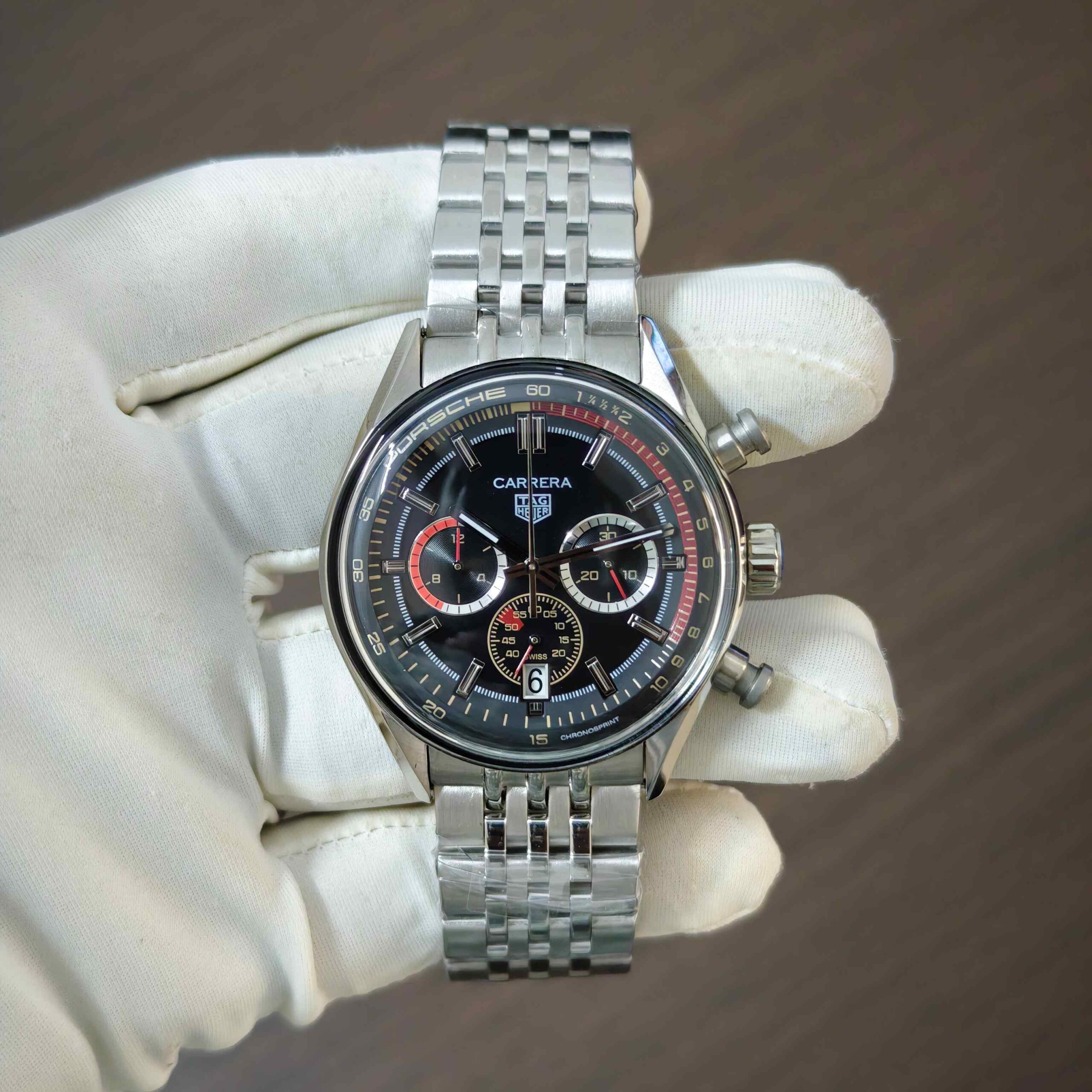 TAG Heuer Carrera Chronosprint x Porsche Rally steel automatic watch featuring a stylish black dial, premium stainless steel case, and sporty motorsport-inspired design.