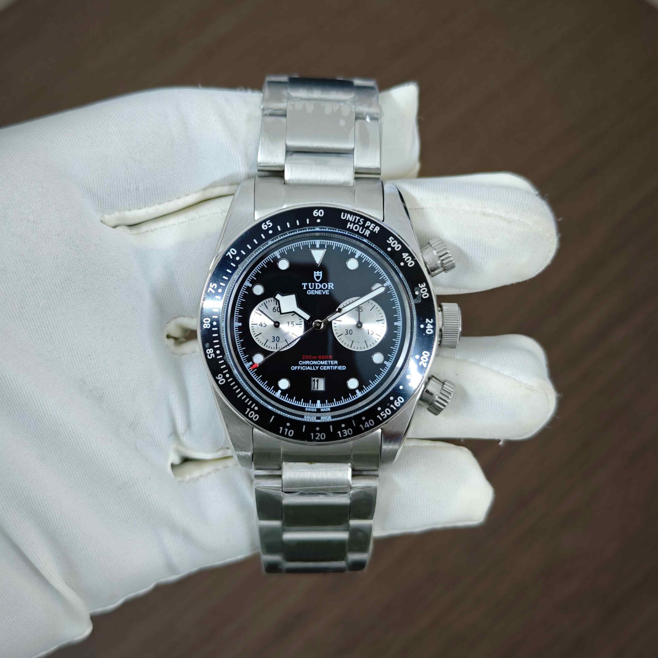 Tudor Black Bay Steel Chronograph automatic watch with black dial, stainless steel case and bracelet, and sporty luxury design.