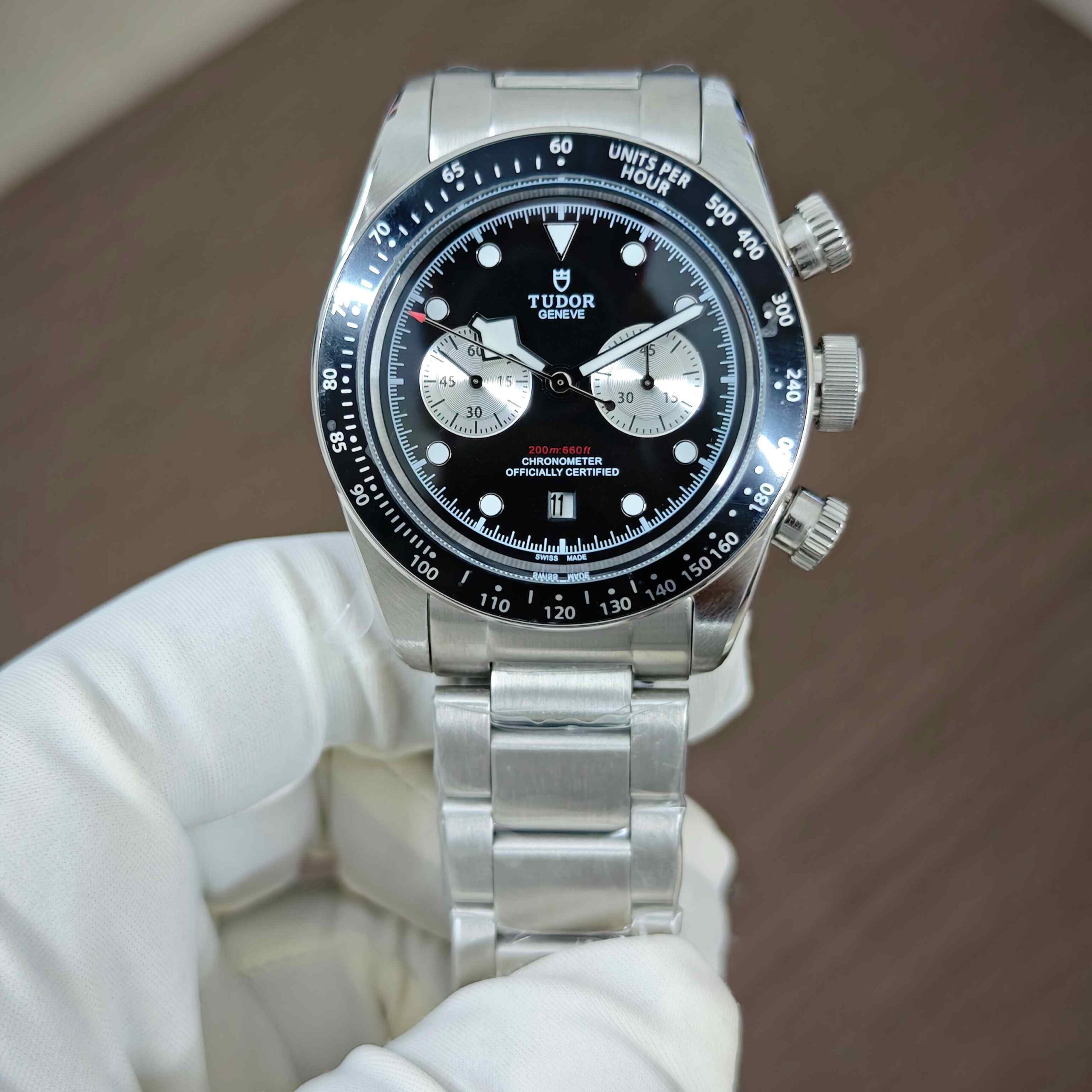 Tudor Black Bay Steel Chronograph automatic watch with black dial, stainless steel case and bracelet, and sporty luxury design.