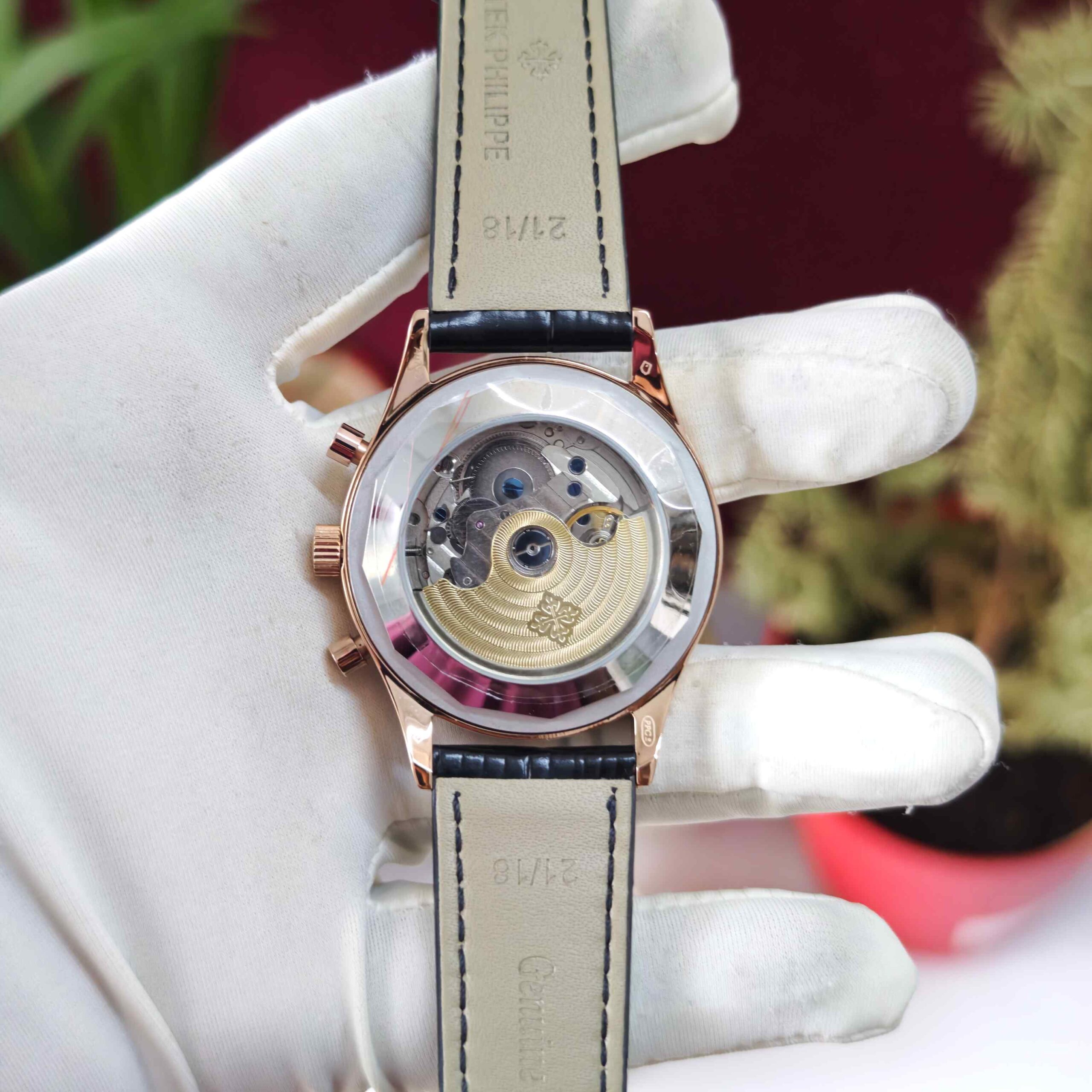 Patek Philippe Annual Calendar Chronograph rose gold automatic watch featuring a diamond bezel, detailed luxury dial, and premium leather strap.