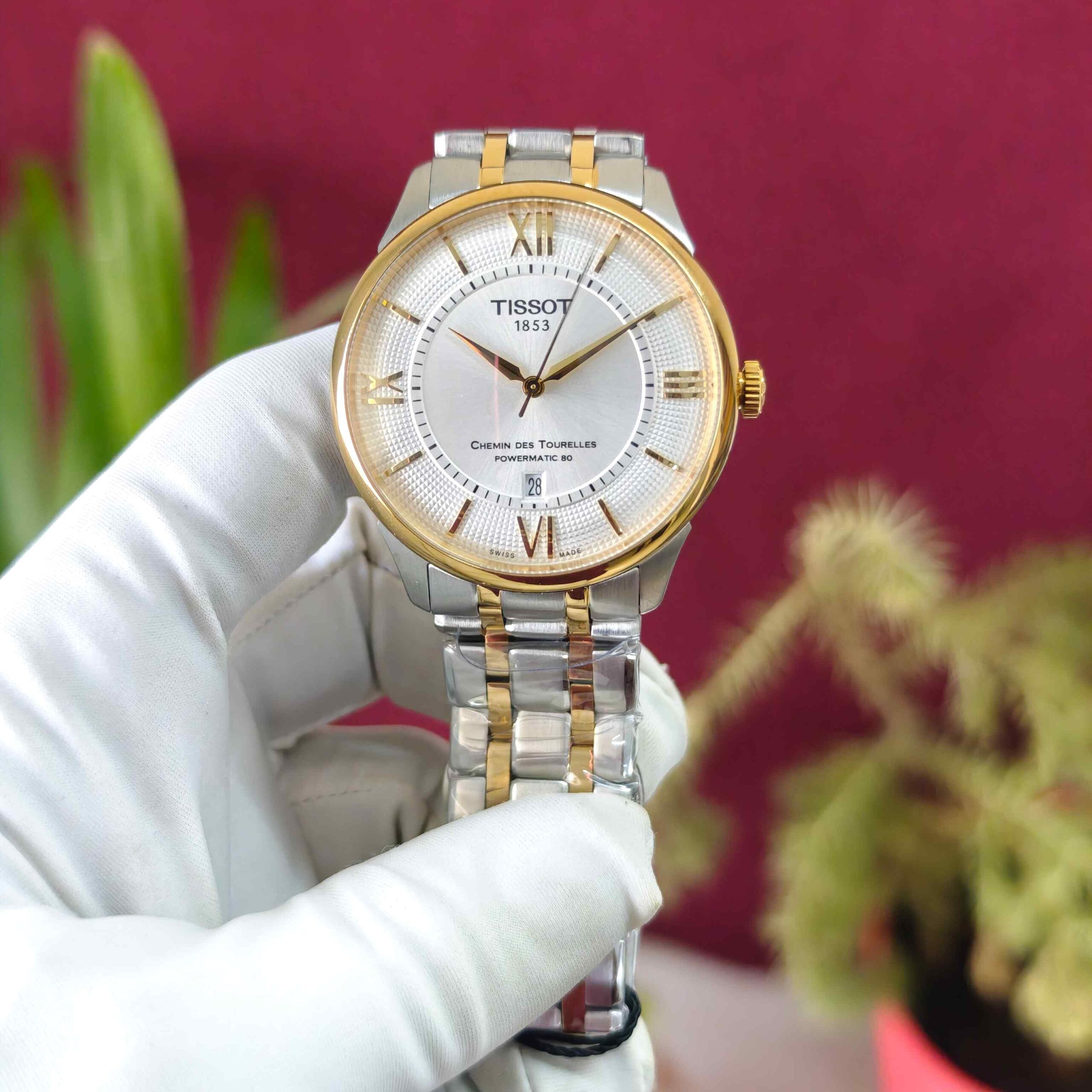 Tissot Chemin des Tourelles Dual Tone White Dial Automatic watch featuring an elegant two-tone case and bracelet, classic white dial, refined markers, and timeless Swiss watchmaking design.