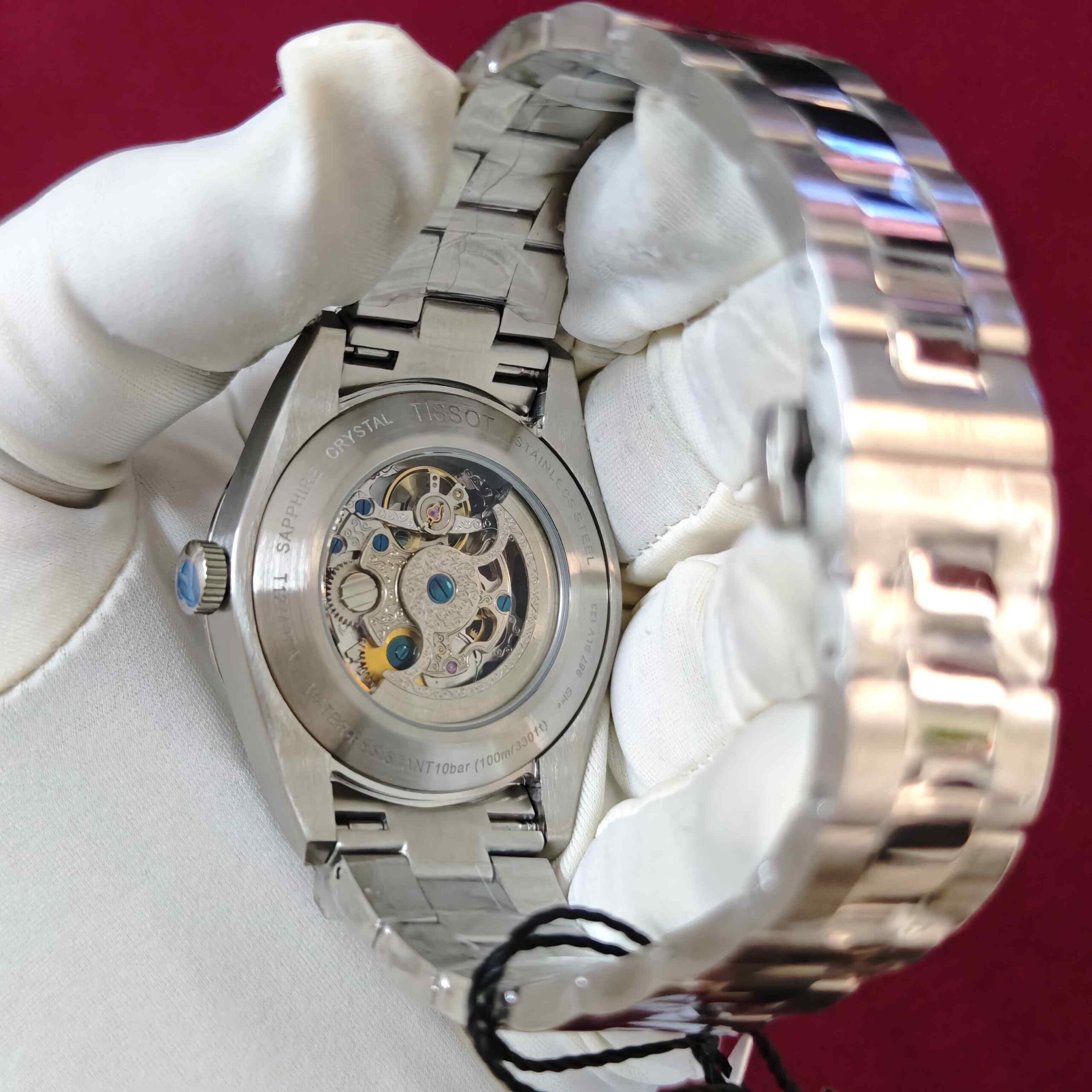 Tissot Gentleman Powermatic 80 Open Heart automatic watch with black dial, stainless steel case and bracelet, featuring an elegant open-heart dial design.