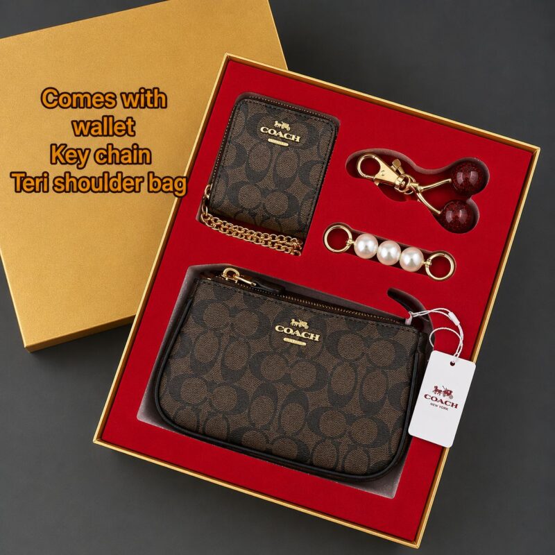 COACH luxury gift set featuring premium designer accessories in an elegant branded gift box.