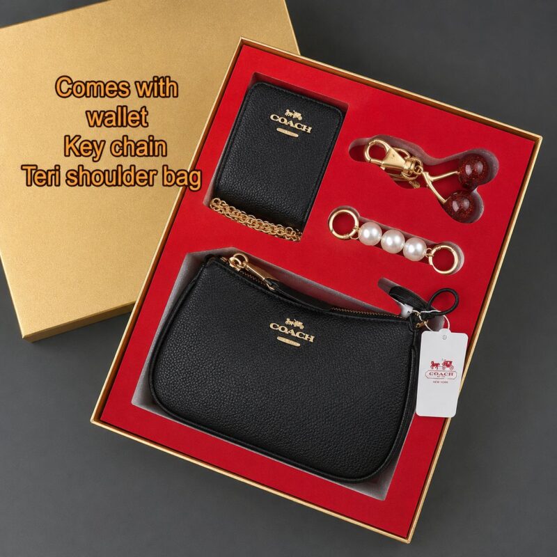 COACH luxury gift set featuring premium designer accessories in an elegant branded gift box.