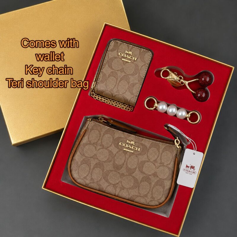 COACH luxury gift set featuring premium designer accessories in an elegant branded gift box.