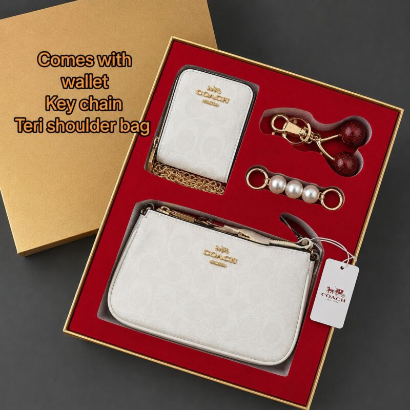 COACH luxury gift set featuring premium designer accessories in an elegant branded gift box.