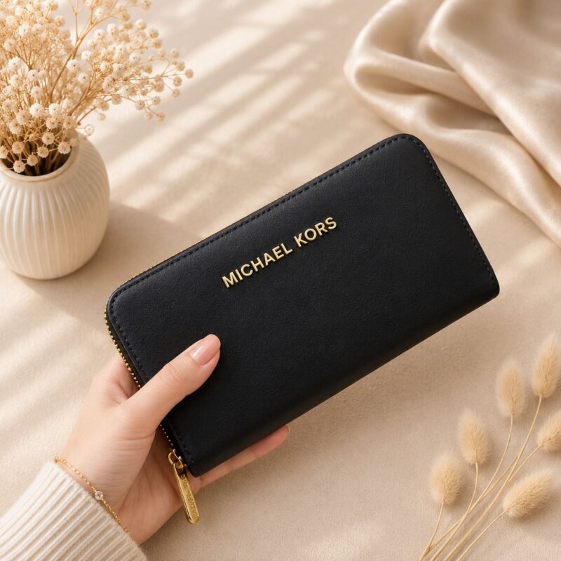 Michael Kors Jet Set Travel Black Wallet in premium black leather with signature designer styling and spacious card compartments.