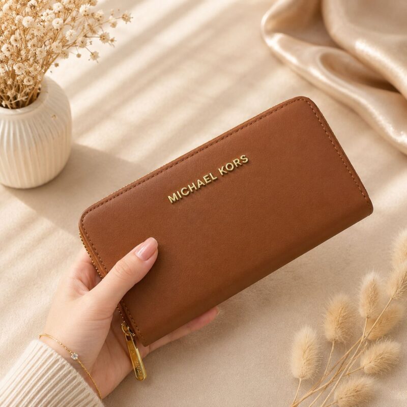 Michael Kors Jet Set Travel Brown Wallet with premium leather finish, zip-around closure, multiple card slots, and elegant designer styling.