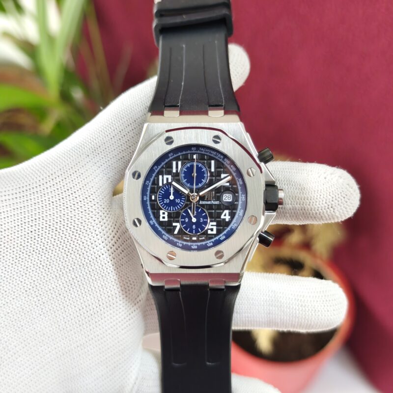 Audemars Piguet Royal Oak Offshore Blue Chronograph Swiss Automatic Watch with black dial, blue bezel, and black rubber strap.