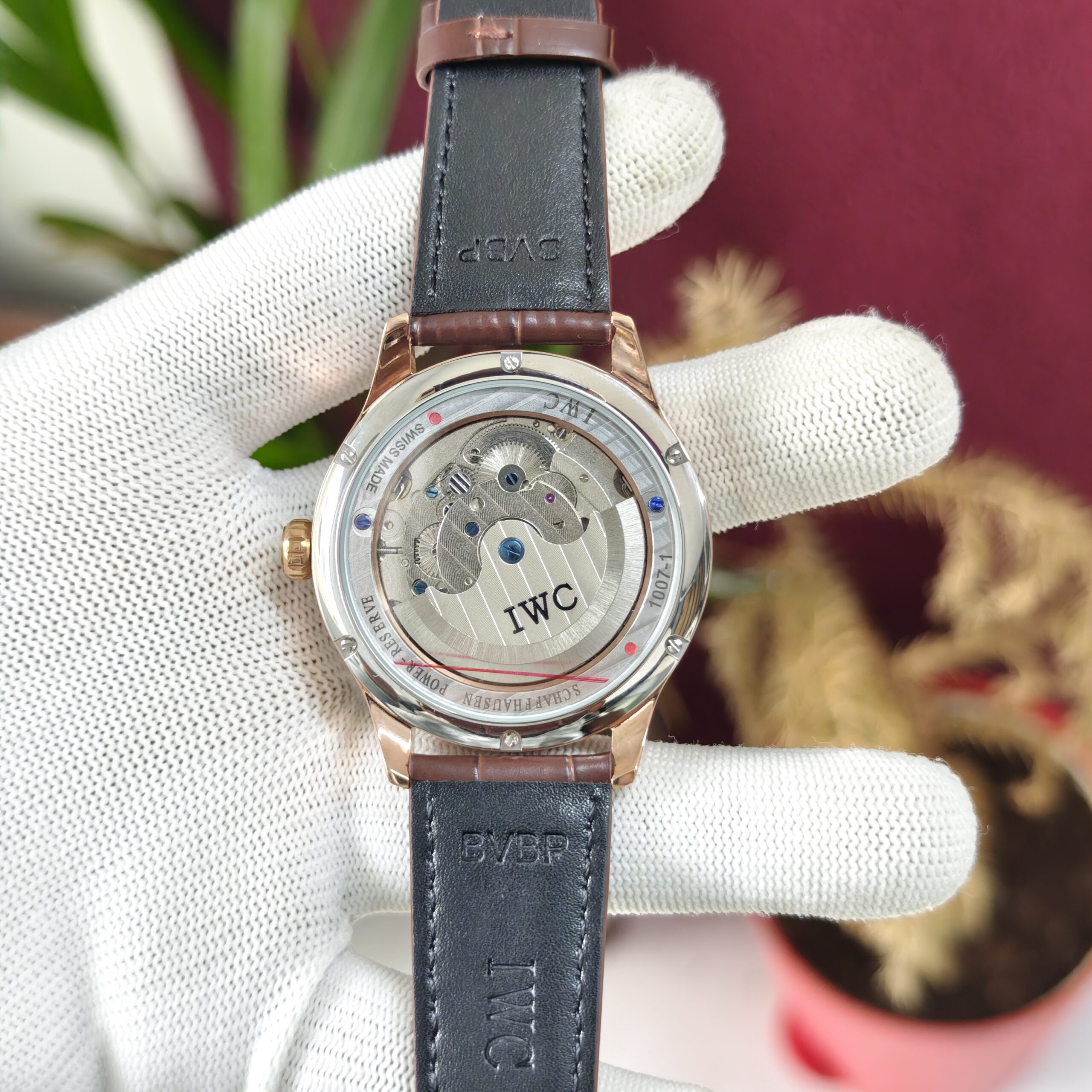 IWC Schaffhausen Portugieser Perpetual Calendar 42 White Dial Swiss Automatic Luxury Watch with elegant leather strap and sapphire crystal.