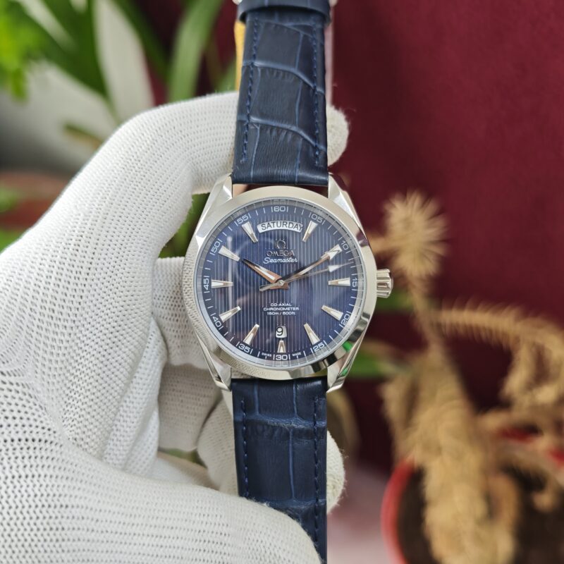 Omega Seamaster Aqua Terra Day-Date Swiss Automatic Watch with stainless steel case, full blue leather strap, and elegant blue dial.