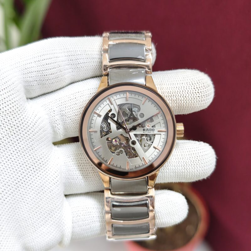 Rado Centrix Silver Dual Tone Skeleton Dial Swiss Automatic Watch with open-heart skeleton dial, sapphire crystal, and premium stainless steel bracelet.
