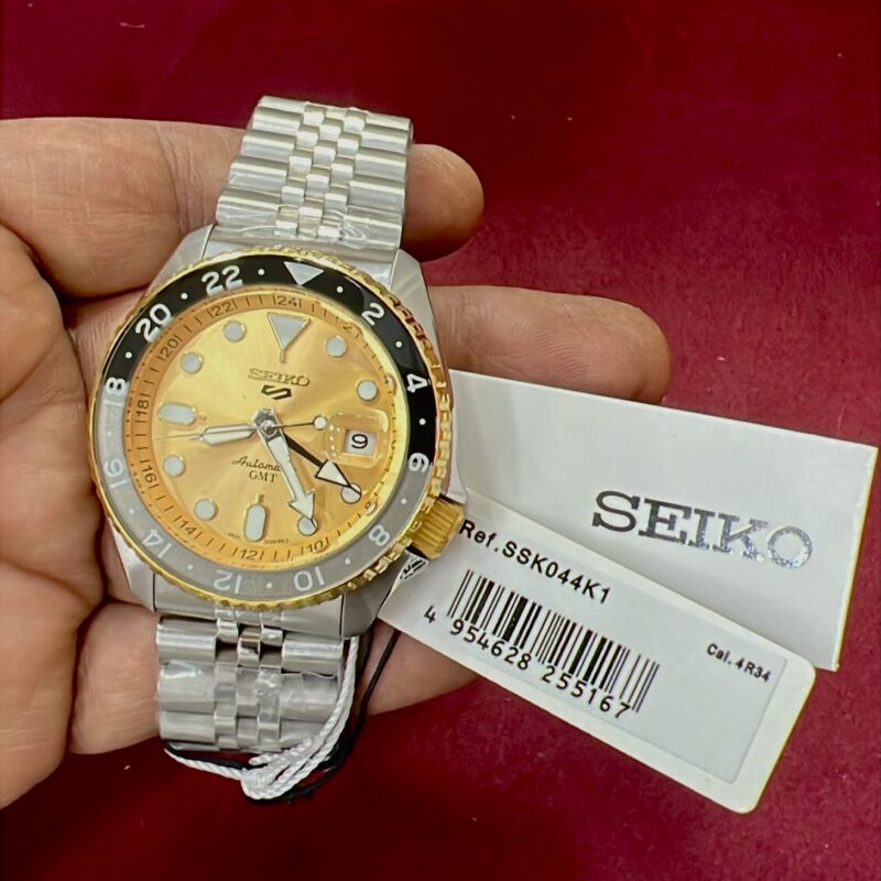 Seiko 5 Sports GMT SSK003K1 polished gold dial Swiss automatic stainless steel men's luxury watch with GMT function.